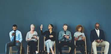 Young people sitting waiting for an interview