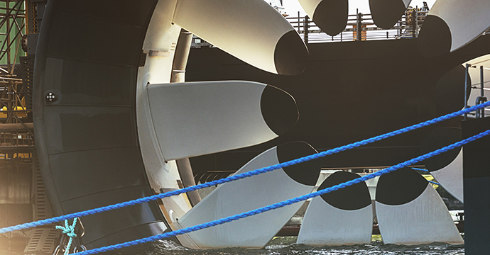 A newly constructed tidal turbine is made ready for deployment on the ocean floor in the Bay of Fundy.