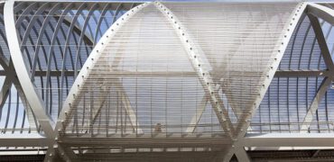 Madrid, Spain - March 31, 2013: Man walking across the Perrault bridge in Madrid